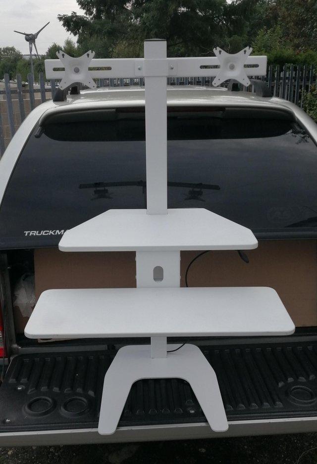 Preview of the first image of Duel screen sit stand desk top converter.