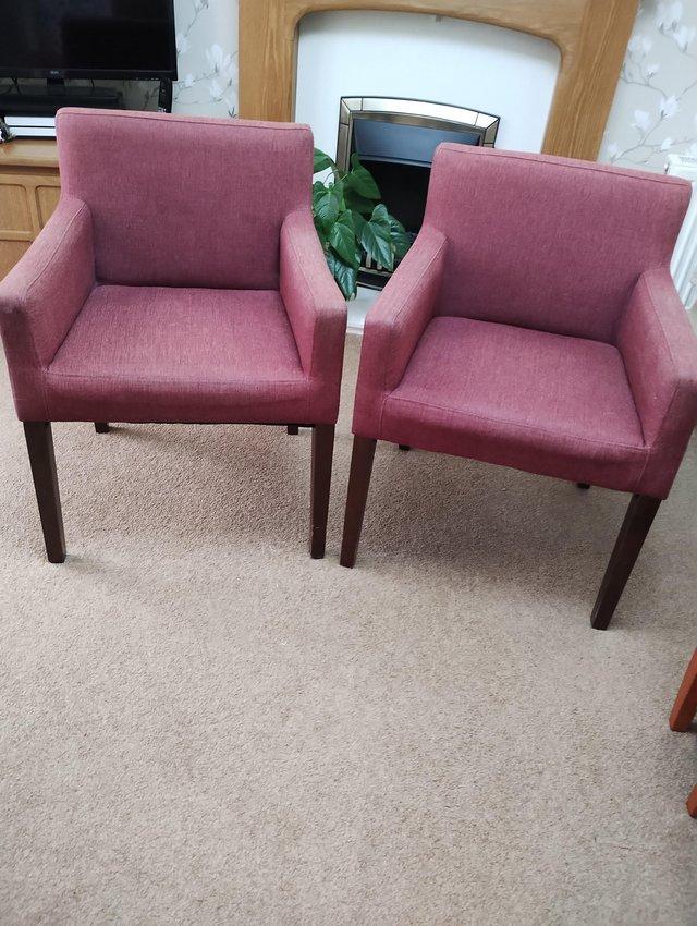 Preview of the first image of Pair of dark red dining chairs.