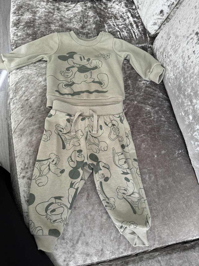 Preview of the first image of 6 - 9 months Mickey Mouse tracksuit.