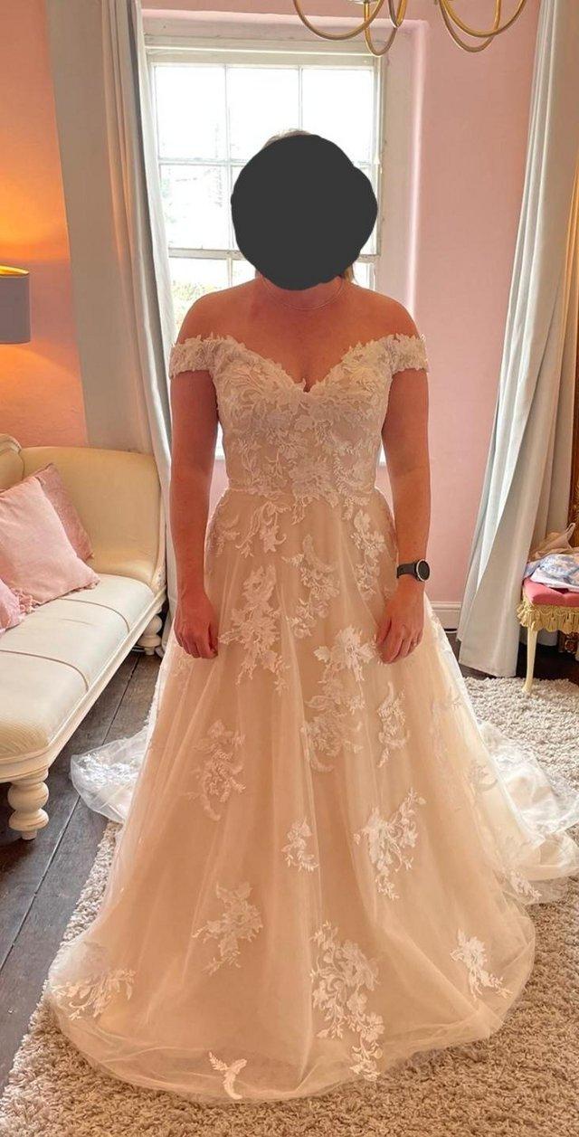 Preview of the first image of Off the shoulder wedding dress.