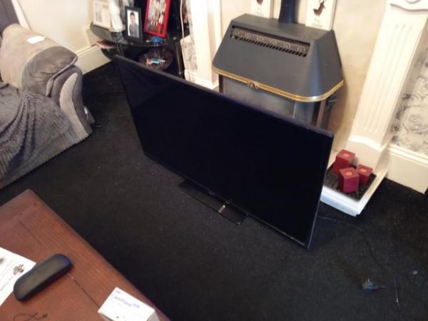 Image 1 of 50 inch TV  comes with remote control