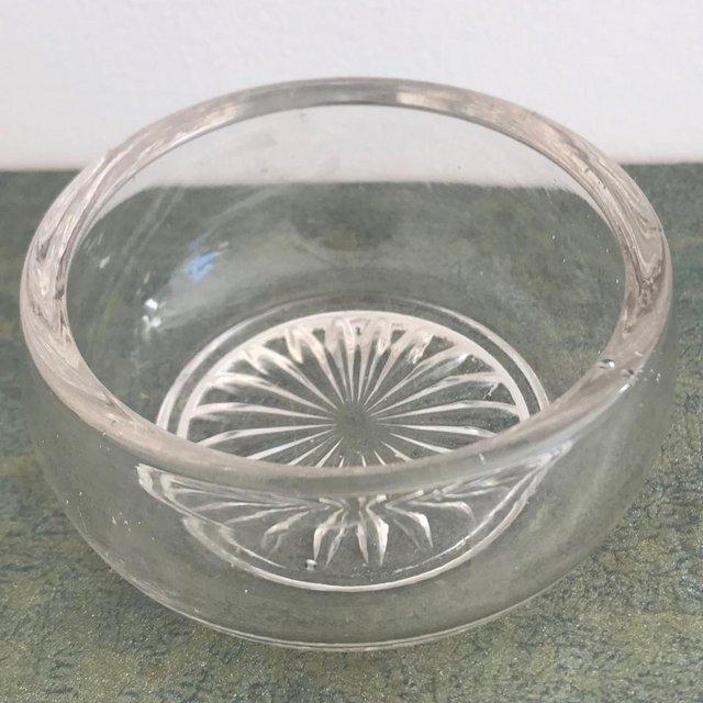 Preview of the first image of Small clear glass dish, pretty design to base..