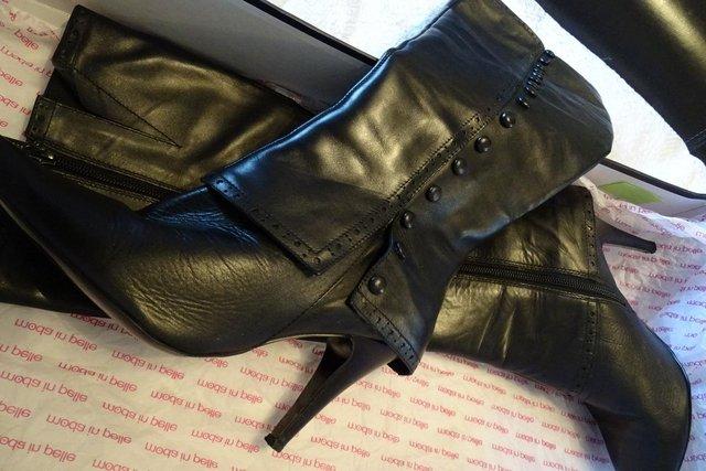 Preview of the first image of Designer ladies knee high black leather boots size 39.