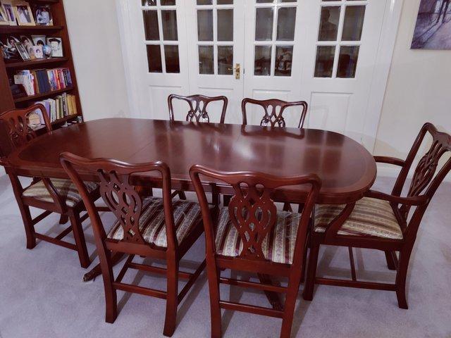 Preview of the first image of Rosewood dining table & 6 chairs - excellent condition.