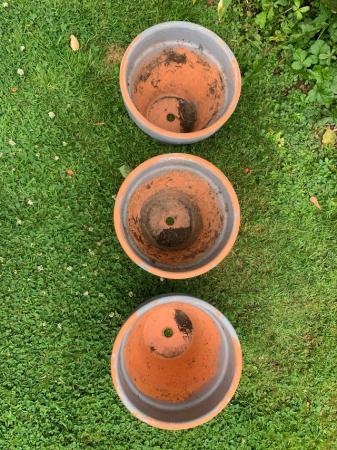Image 1 of 3 terracotta plant pots