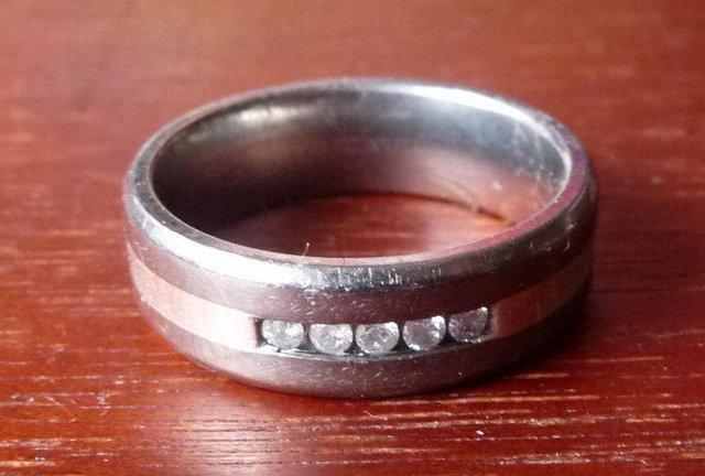 Preview of the first image of TITANIUM AND 5 CHANNEL SET DIAMOND RING. PRE-OWNED. SIZE T+.