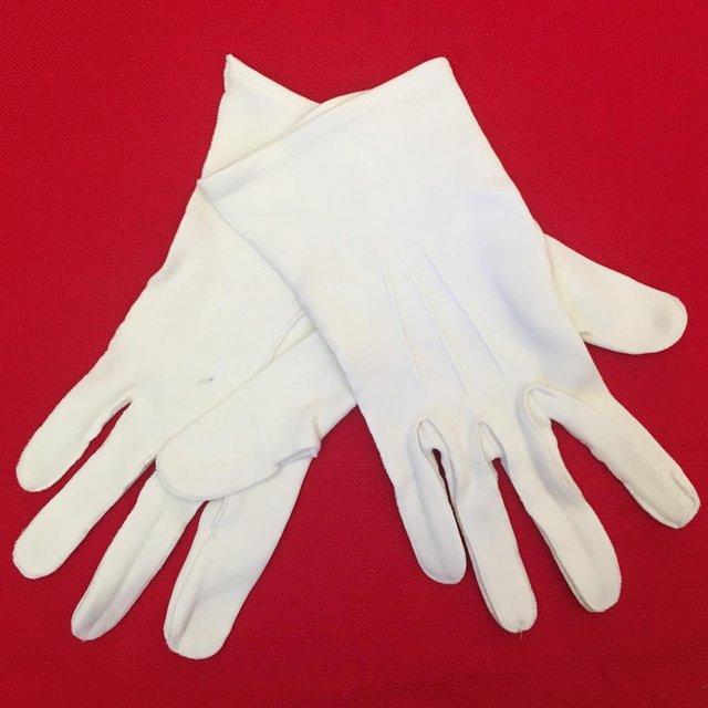 Preview of the first image of Pair of vintage white lightweight fabric gloves,small womens.