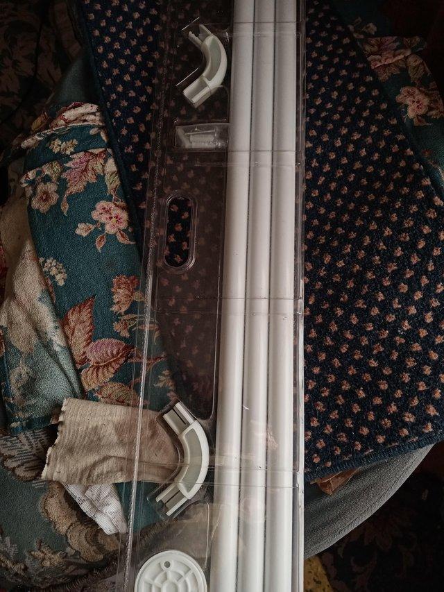 Preview of the first image of Universal Shower Curtain Rods Brand New.