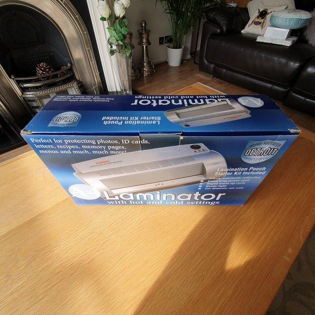 Preview of the first image of New in box. Detroit Home Security A4 laminator..