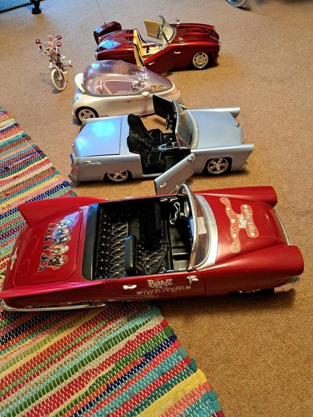 Preview of the first image of Bratz collectibles. Four cars and a tandam.