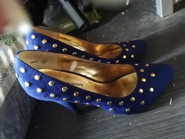 Preview of the first image of Blue and gold court shoes size 3.