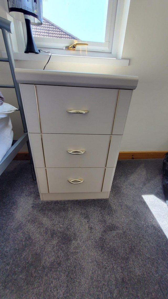 Preview of the first image of White with gold detail bedside drawers.