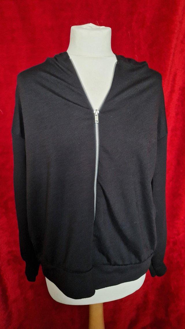 Preview of the first image of Ladies Black Hoody size 14.