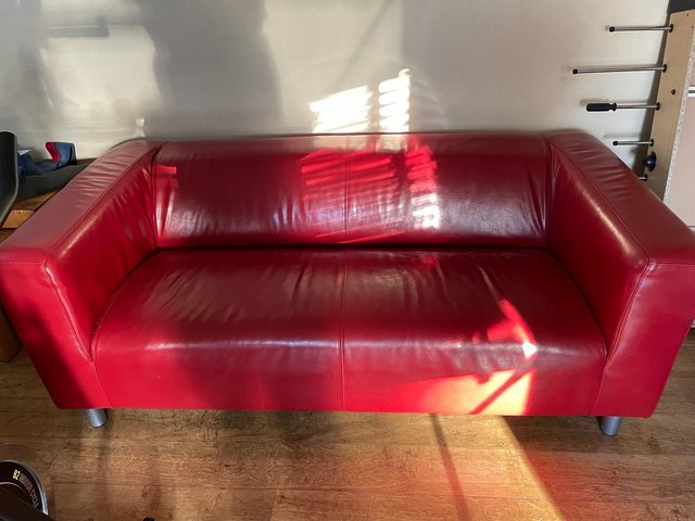 Preview of the first image of Red Faux leather sofa originally from IKEA.