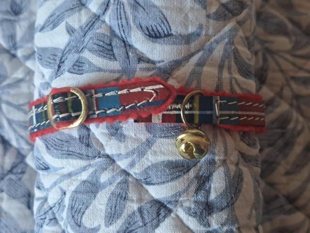 Preview of the first image of THREE RED TARTAN CAT COLLARS WITH BELL AND SAFETY ELASTIC.