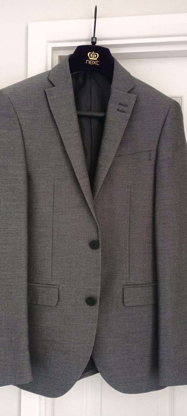 Preview of the first image of Mens NEXT slim fit 34R grey suit jacket.