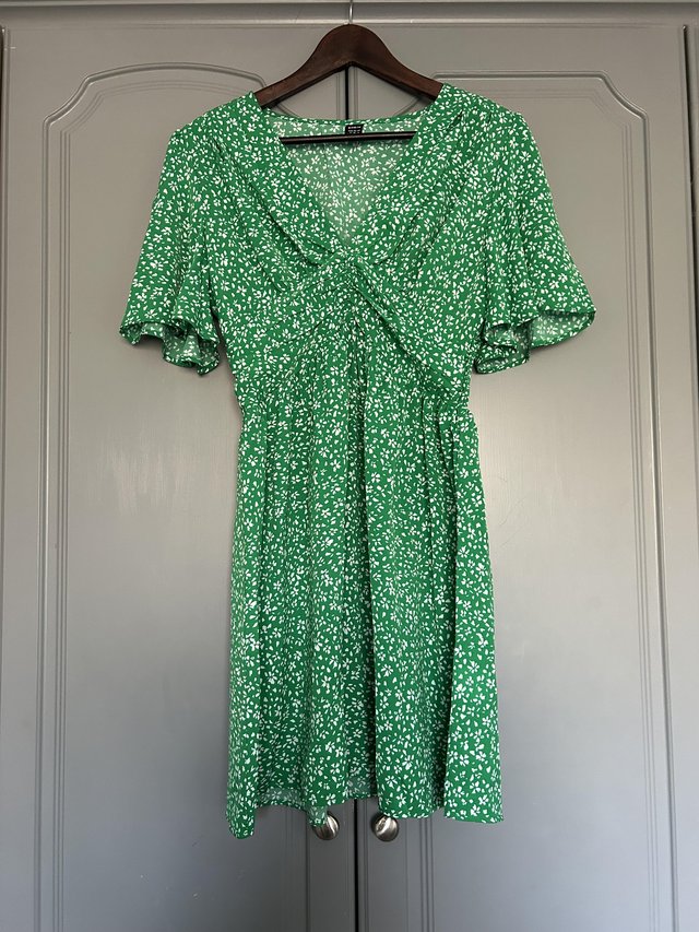 Preview of the first image of SHEIN Green Pattern Midi Dress V Neck Size XS.