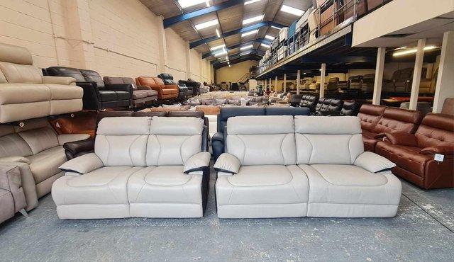 Preview of the first image of La-z-boy grey and black leather 3+2 seater sofas.
