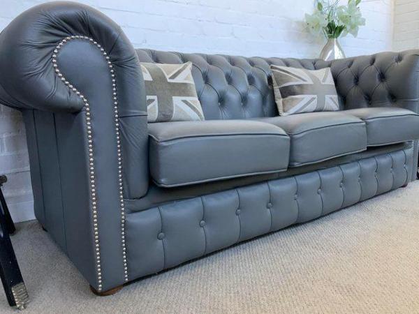 Image 6 of Grey Chesterfield sofa. Armchair & footstool available.