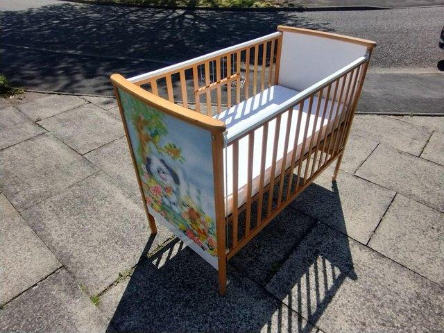 Preview of the first image of Mothercare cot and nearly new mattress.
