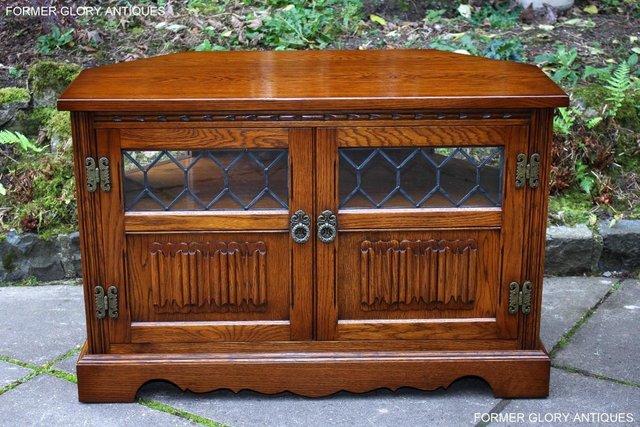 Preview of the first image of OLD CHARM LIGHT OAK CORNER TV STAND MEDIA DVD CABINET UNIT.