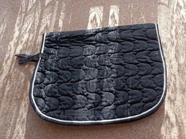 Image 3 of Full size, black saddle cloth with white braid.