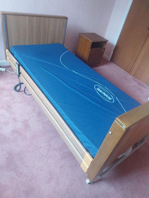 Preview of the first image of Alerta Low Profiling Hospital Bed with side rails.