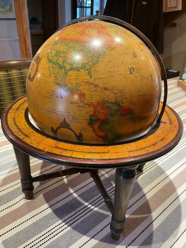 Preview of the first image of Wooden Globe On Stand That Spins.