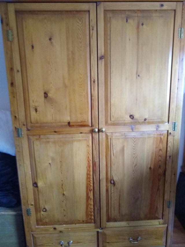 Preview of the first image of Beautiful stained pine double wardrobe.