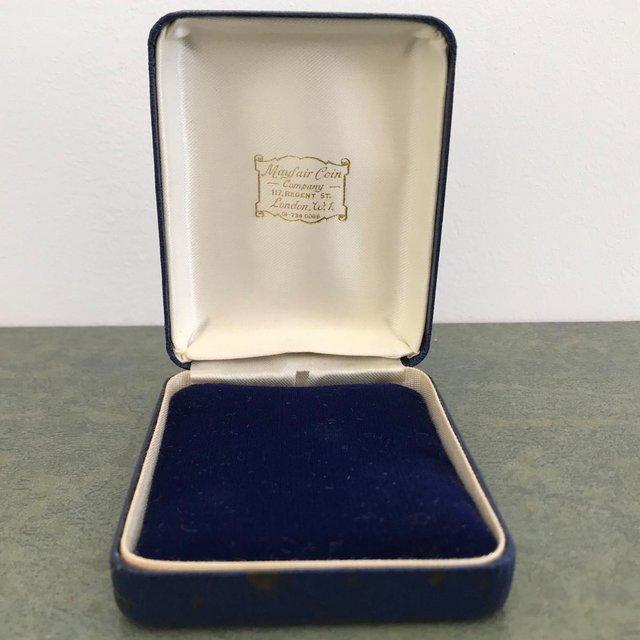 Preview of the first image of Vintage Mayfair Coin Company jewellery box.Navy faux-leather.