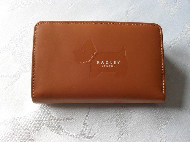 Preview of the first image of NEW RADLEY 'LARGE EMBOSS DOG' LEATHER PURSE.