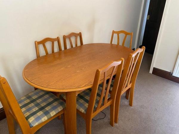 Image 1 of Wooden Table and 6 upholstered chairs