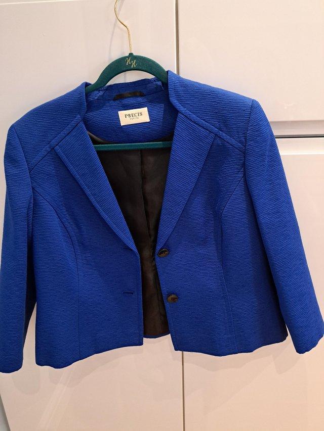 Preview of the first image of Ladies Royal blue jacket with three quarter length sleeves.