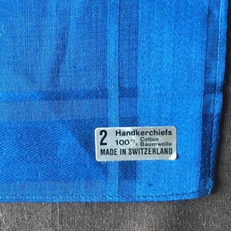 Image 2 of 2 men's handkerchiefs. Brown and navy blue (unused).