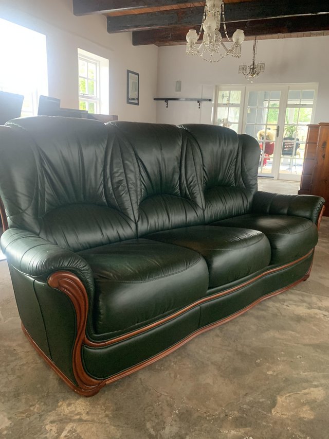 Preview of the first image of Lovely 3 piece Green leather suite wood trim as new £200.