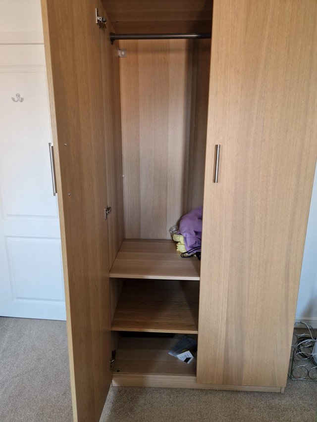 Preview of the first image of Ikea malm double wardrobe with shelves.