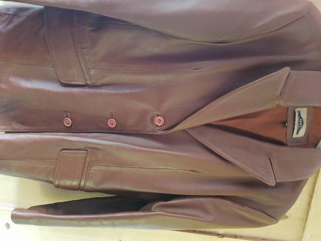 Preview of the first image of ladies tan  leather jacket size 16.