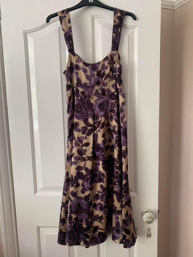 Preview of the first image of Lk Bennett purple and gold floral dress. Silky material line.