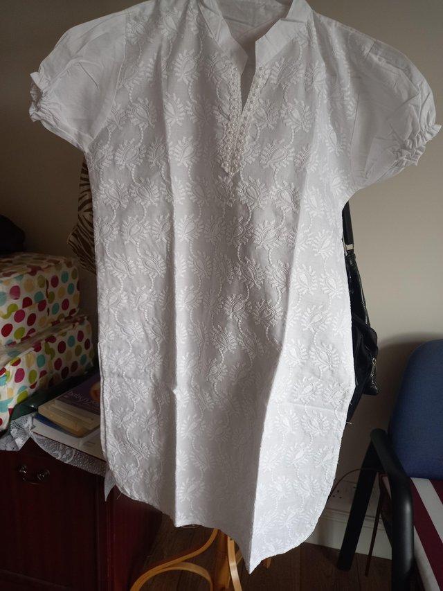 Preview of the first image of New pure cotton embroidered white long top.