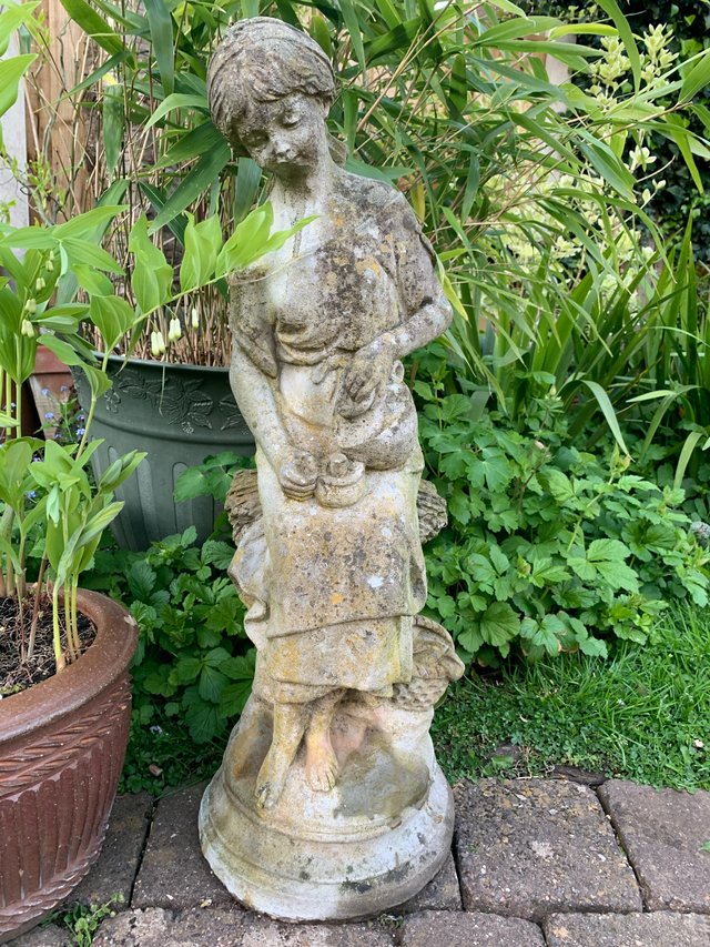 Preview of the first image of Charming weathered garden statue / ornament.