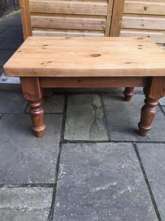 Image 3 of A very sturdy low pine table with turned legs.