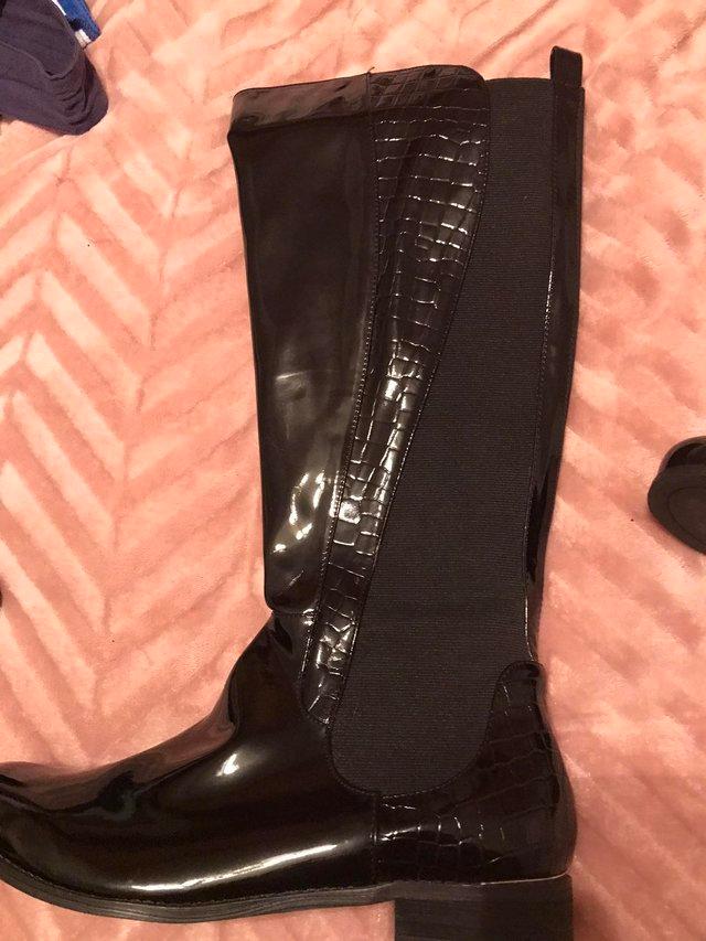 Preview of the first image of Black Knee length boots new size 7.
