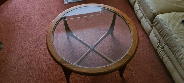 Preview of the first image of Circular wood and glass coffee table.