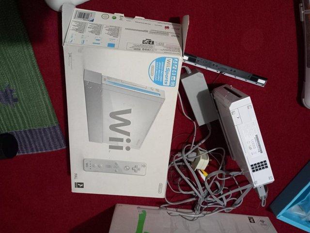 Preview of the first image of Two  Wii Fit boards and Nintendo and manuals.