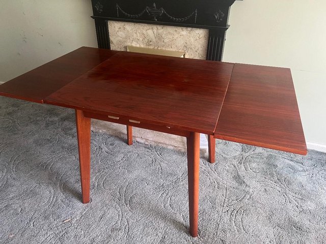 Preview of the first image of Dining room table-well used but sturdy.