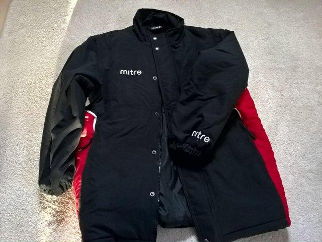 Preview of the first image of Mitre boy's coat black age 13 as new.