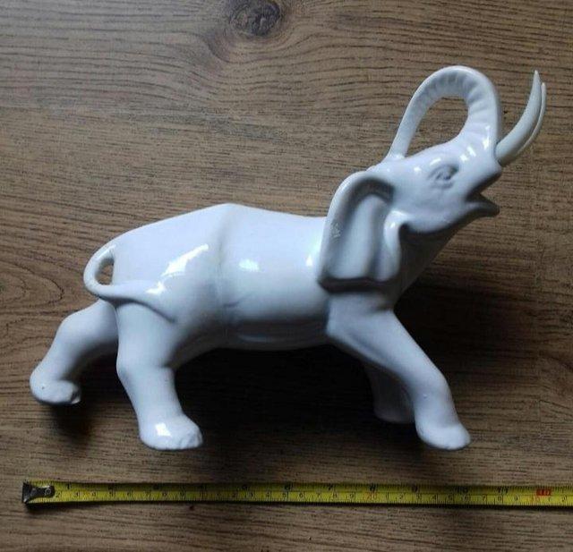 Preview of the first image of VINTAGE WHITE PORCELAIN ELEPHANT.