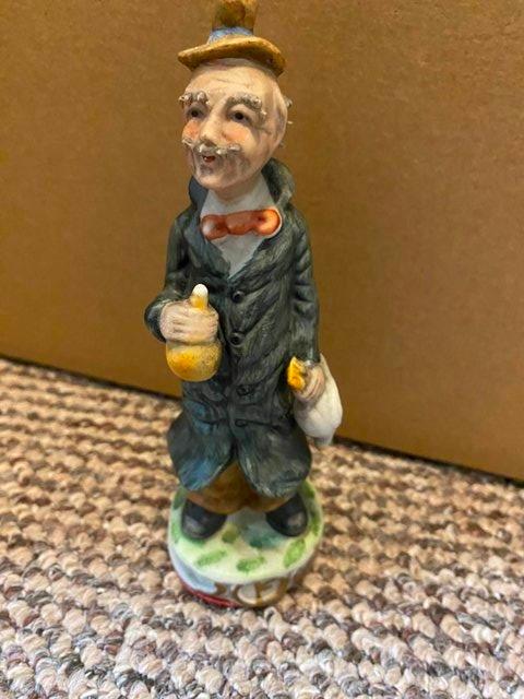 Preview of the first image of Vintage CapoDiMonte figure Old Man with Goose.