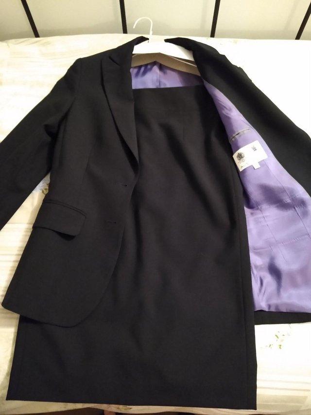 Preview of the first image of Austin Reed black suit, size 6.