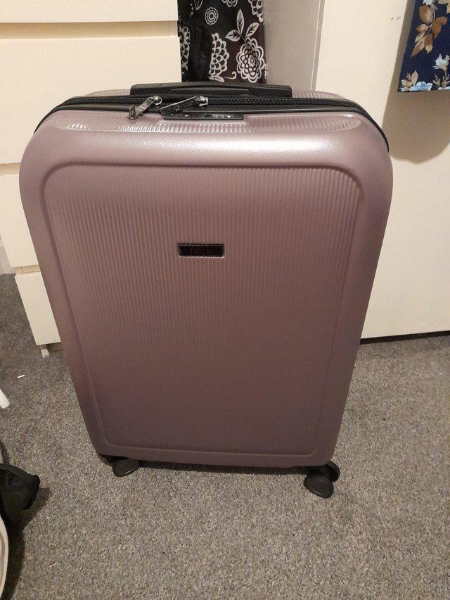 Preview of the first image of Hardshell 4 wheeled suitcase in purple.